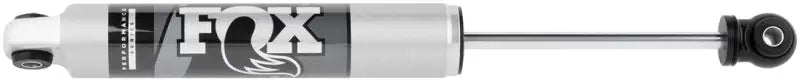 Fox 2018+ Jeep Wrangler JL 2.0 Performance Series 7.43in. Smooth Body IFP Steering Stabilizer (Alum) featuring aluminum reservoir clamp and black anodized CNC machined aluminum components for heat dissipation.