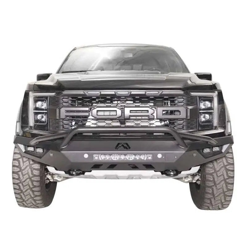 FR21-D5352-1 Fab Fours Vengeance Front bumper on a black Ford truck, showcasing rugged design, integrated lighting, and winch compatibility.