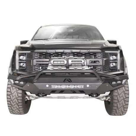 FR21-D5352-1 Fab Fours Vengeance Front bumper on a black Ford truck, showcasing rugged design, integrated lighting, and winch compatibility.