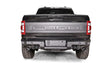 FR21-W5351-1 Fab Fours Premium Rear bumper installed on Ford F-150 Raptor, showcasing its rugged design and durable construction for enhanced rear-end protection.