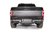FR21-W5351-1 Fab Fours Premium Rear bumper installed on Ford F-150 Raptor, showcasing its rugged design and durable construction for enhanced rear-end protection.
