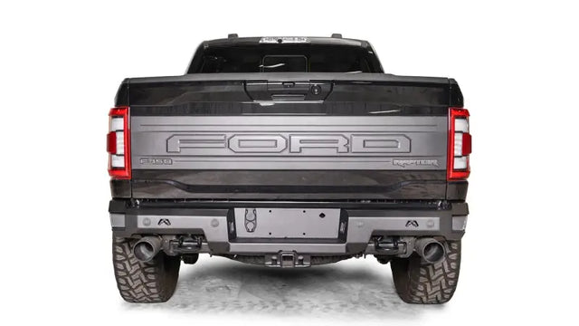 FR21-W5351-1 Fab Fours Premium Rear bumper installed on Ford F-150 Raptor, showcasing its rugged design and durable construction for enhanced rear-end protection.