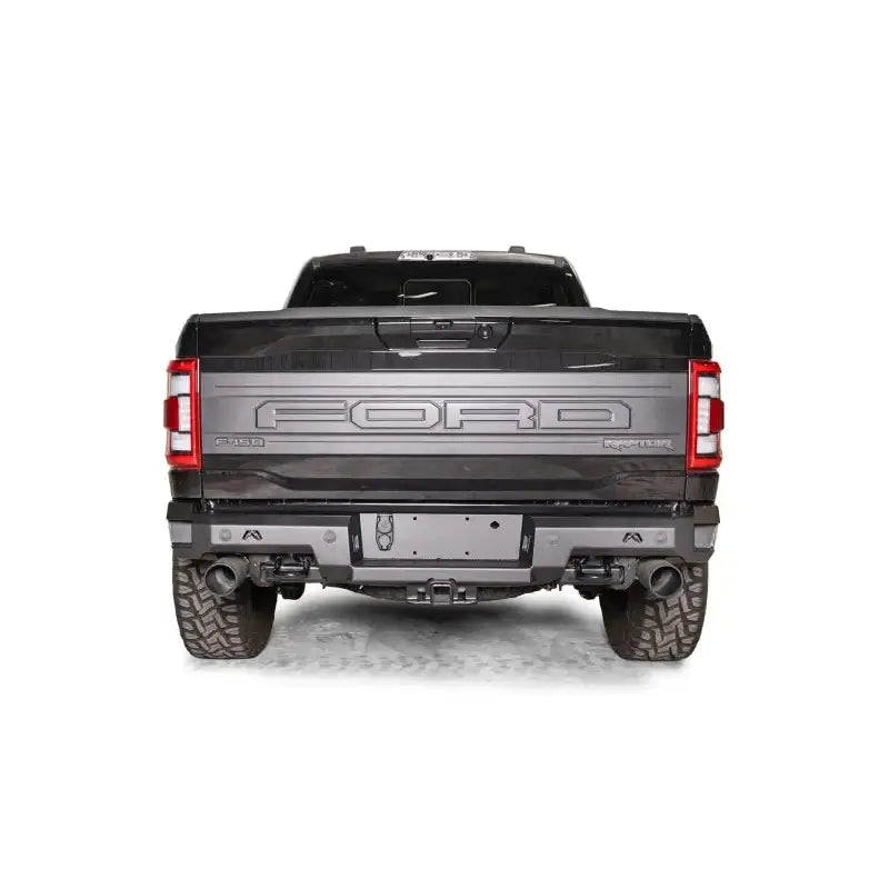 FR21-W5351-1 Fab Fours Premium Rear bumper installed on Ford F-150 Raptor, showcasing its rugged design and durable construction for enhanced rear-end protection.