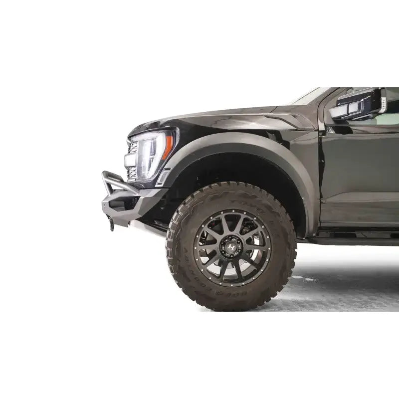 FR21-X5351-1 Fab Fours Matrix Front bumper installed on a black vehicle, showcasing its rugged and sleek design for premium front-end protection.