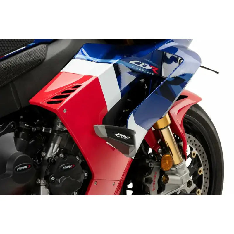 Red, white, and blue sport motorcycle with crash protectors for frame sliders RV parts