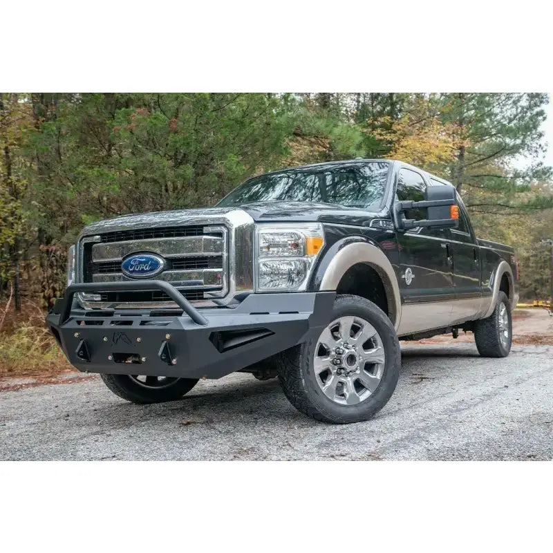 Fab Fours 2011-2016 Ford SD F250-F550 Red Steel Bumper installed on a black Ford Super Duty truck, showcasing superior protection and rugged style for on and off-road use, RV, Automotive, Powersports, off-road, marine, exterior, truck accessories, interior, truck bed, RV parts, Bumpers, Grilles & Guards, AVADA - Best Sellers, Must Haves