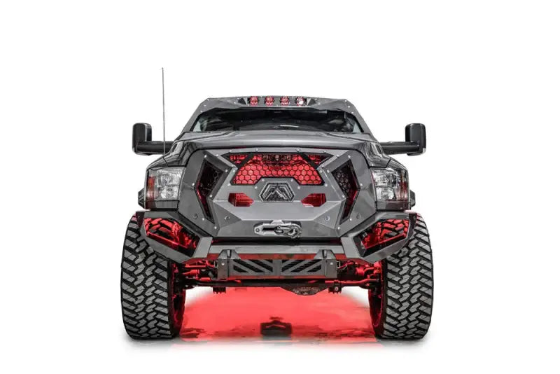 Front view of a 2017 Ford F250-350 equipped with the Fab Fours FS17-A4150-1 winch bumper, boasting a sleek black and gray finish and rugged design for enhanced front-end protection.