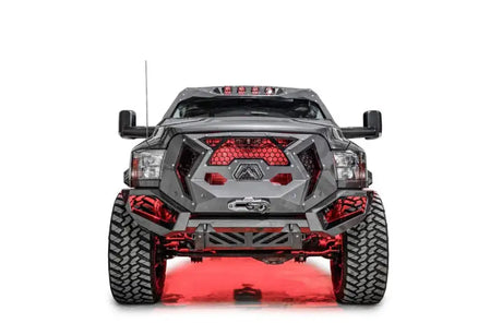 Front view of a 2017 Ford F250-350 equipped with the Fab Fours FS17-A4150-1 winch bumper, boasting a sleek black and gray finish and rugged design for enhanced front-end protection.