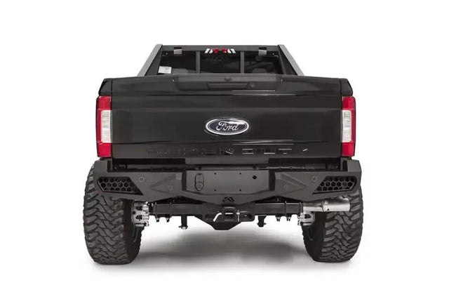 Rear view of a Ford Super Duty F250-F350 equipped with FS17-E4151-1 Fab Fours Ven Sen R bumper, showcasing its rugged and stylish design.