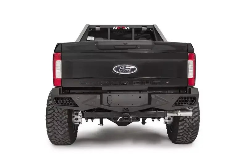Rear view of a Ford Super Duty F250-F350 equipped with FS17-E4151-1 Fab Fours Ven Sen R bumper, showcasing its rugged and stylish design.