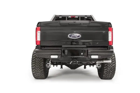 Rear view of a Ford F250 truck equipped with the FS17-T4150-1 Fab Fours rear bumper, showcasing rugged construction and sleek design for enhanced protection and style.