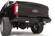 FS17-T4150-1 Fab Fours rear bumper on Ford F250/F350 truck, showcasing robust construction and sleek design for enhanced protection.