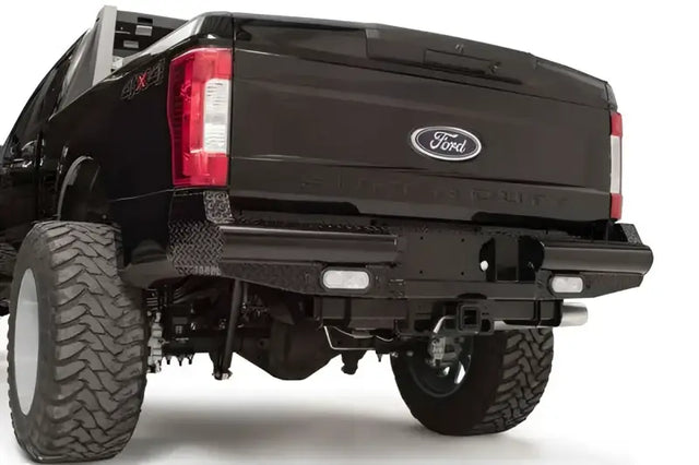 FS17-T4150-1 Fab Fours rear bumper on Ford F250/F350 truck, showcasing robust construction and sleek design for enhanced protection.