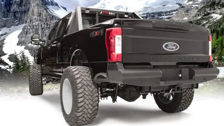 FS17-U4150-1 Fab Fours rear bumper on a Ford F250/F350 Super Duty in a mountain setting.