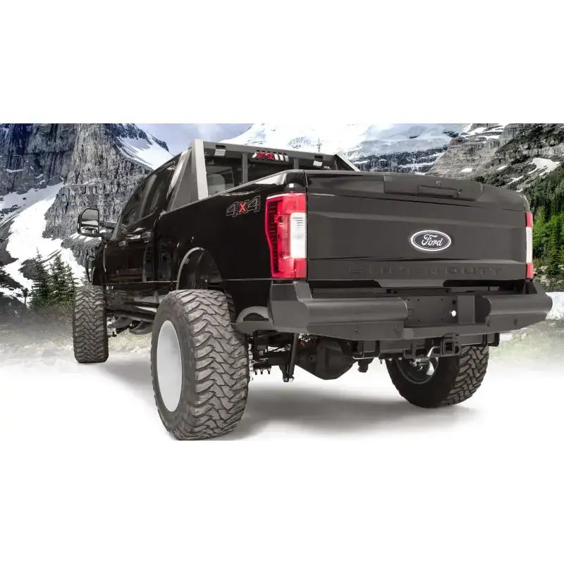 FS17-U4150-1 Fab Fours rear bumper on a Ford F250/F350 Super Duty in a mountain setting.