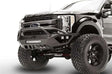Fab Fours FS17-V4152-1 Vengeance Front Bumper on 2017 Ford F250/F350, showing heavy-duty construction, integrated LED light bar, winch-ready design, and aggressive off-road style.