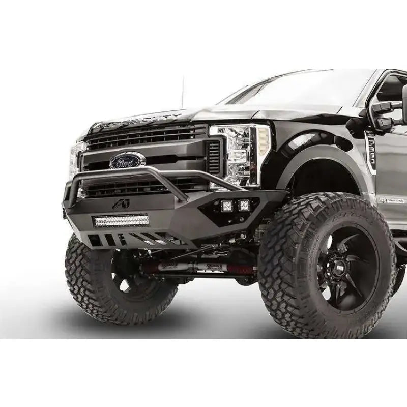 Fab Fours FS17-V4152-1 Vengeance Front Bumper on a 2017 Ford F250/F350, showcasing its heavy-duty construction, integrated 20" LED light bar, and winch-ready design.