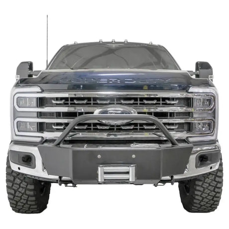 Front view of a vehicle equipped with the FS23-N5960-1 Fab Fours Winch Mount, showcasing its robust and secure off-road mounting solution.