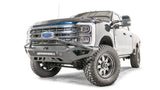 FS23-V5952-1 Fab Fours Vengeance Front bumper on a white Ford truck, showcasing its rugged design and enhanced vehicle protection.