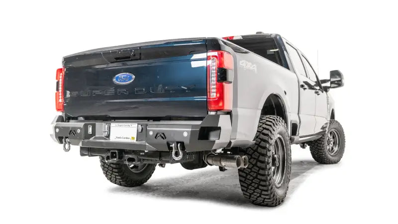 FS23-W5951-1 Fab Fours Premium Rear Bumper installed on a 2023 Ford Super Duty, showcasing rugged aesthetic and enhanced rear protection.