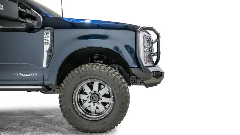 FS23-X5950-1 Fab Fours Matrix Front bumper on a blue truck, showcasing superior protection and sleek design, suitable for off-road and urban use, RV, Automotive, Powersports, off-road, marine, exterior, truck accessories, interior, truck bed, rv parts, Bumpers, Grilles & Guards, AVADA - Best Sellers, Must Haves
