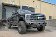 FS23-X5951-1 Fab Fours Matrix Front Bumper on a black Ford truck, showcasing its rugged design and superior front-end protection in a parking lot.