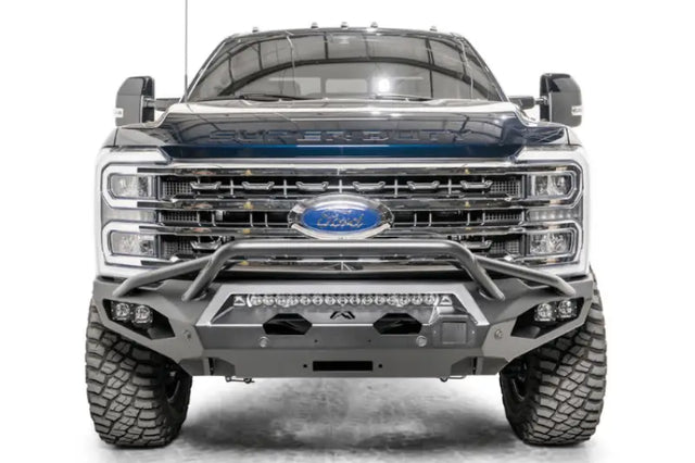 Front view of a vehicle equipped with the FS23-X5952-1 Fab Fours Matrix Front bumper, showcasing aggressive styling and high-quality construction, ideal for RV, automotive, powersports, off-road, marine, exterior, truck accessories, and more. Bumpers, Grilles & Guards, AVADA - Best Sellers, Must Haves