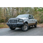 Fab Fours FS99-RS1662-1 red steel bumper on 1999-2004 Ford Super Duty F250-F550, enhancing rugged style and off-road protection.
