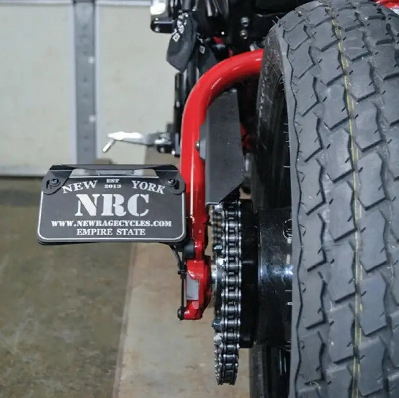 FTR-SIDE Side Mount License Plate on motorcycle rear wheel with drive chain and license plate mount license