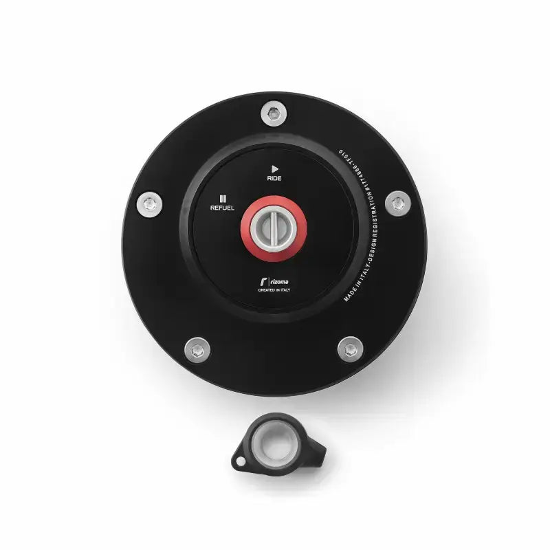 Black motorcycle gas cap with locking feature and red central knob for added security