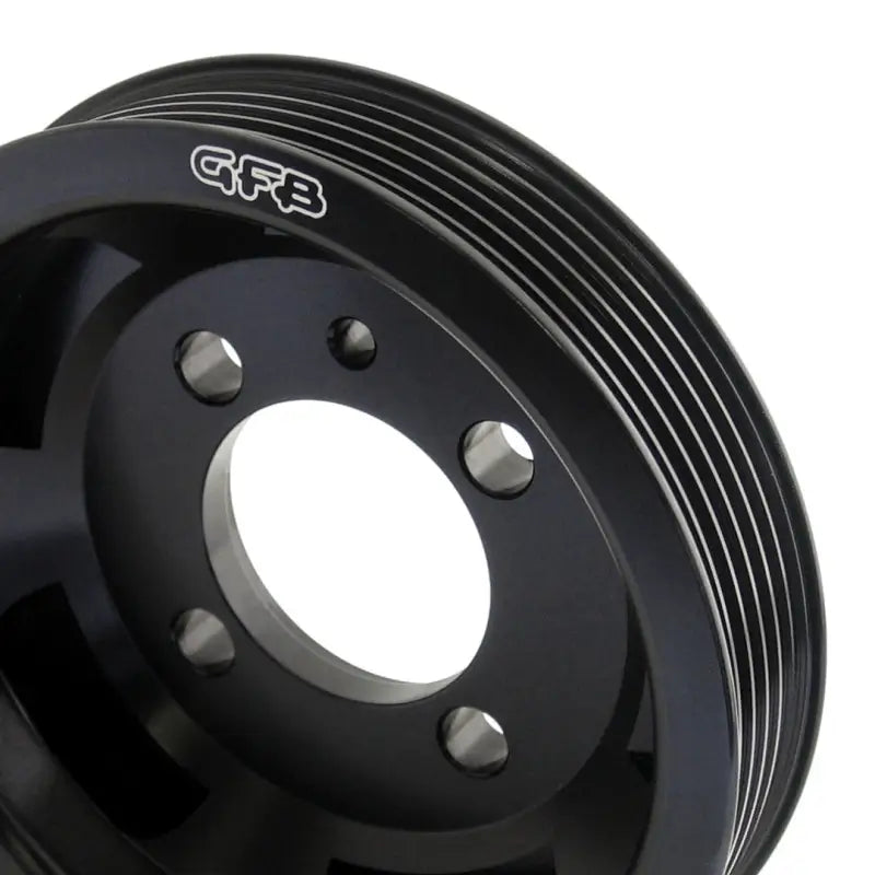 Black metal GFB Evo crank pulley with multiple grooves for under-drive crank pulley setup