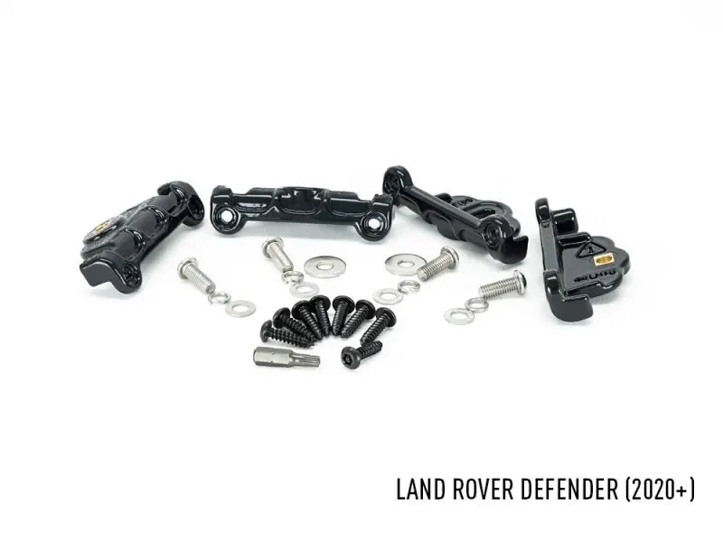 Black metal mounting hardware for Land Rover Defender grill on GM-USDEF750-01K Triplerlight