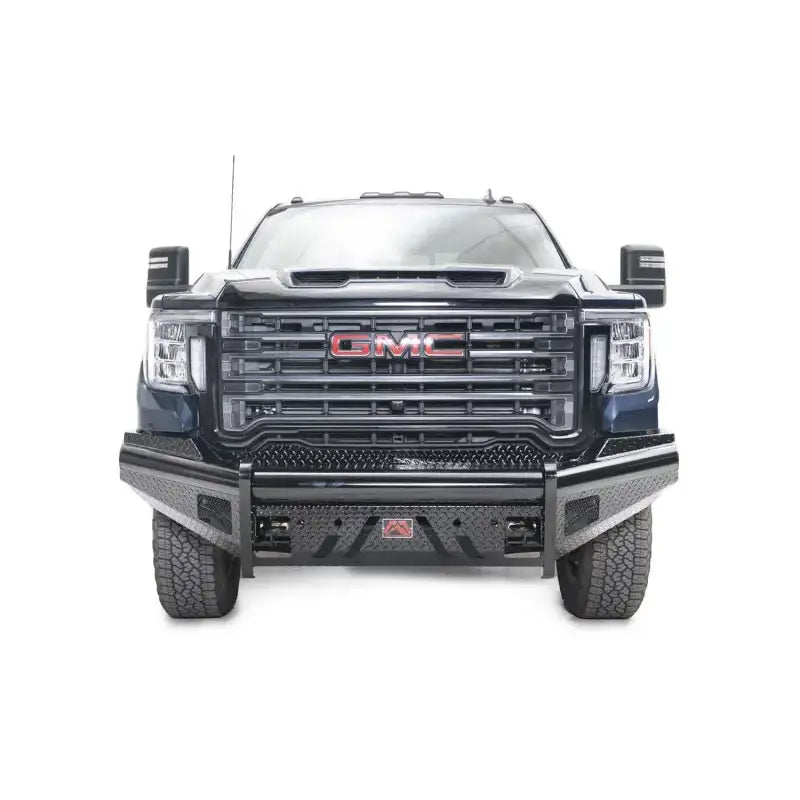 Front view of a GMC truck outfitted with the rugged GM20-S5061-1 Fab Fours Black Steel Front bumper, showcasing enhanced protection and a robust aesthetic.