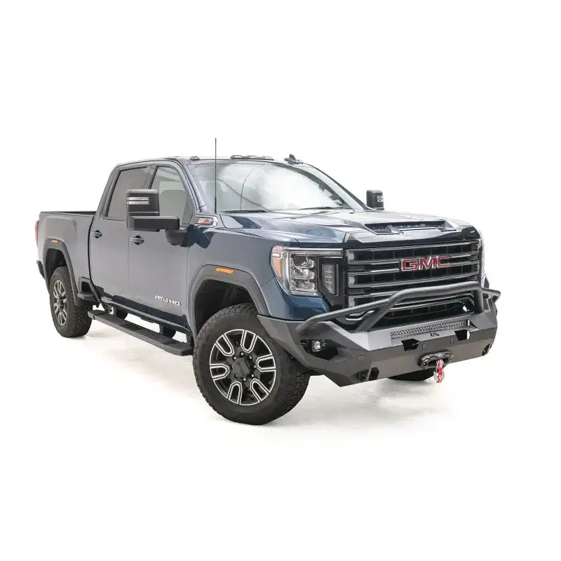 GM20-X5052-1 Fab Fours Matrix Front Pr installed on a blue GMC truck, showcasing robust construction and sleek design for superior off-road protection.