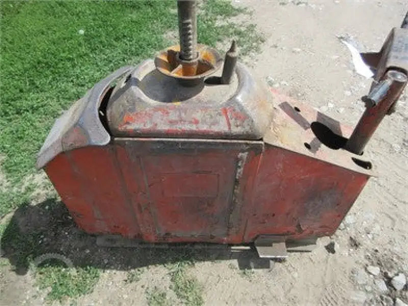 Red and gray tire changing machine with Demco Slider Gooseneck head for easy use