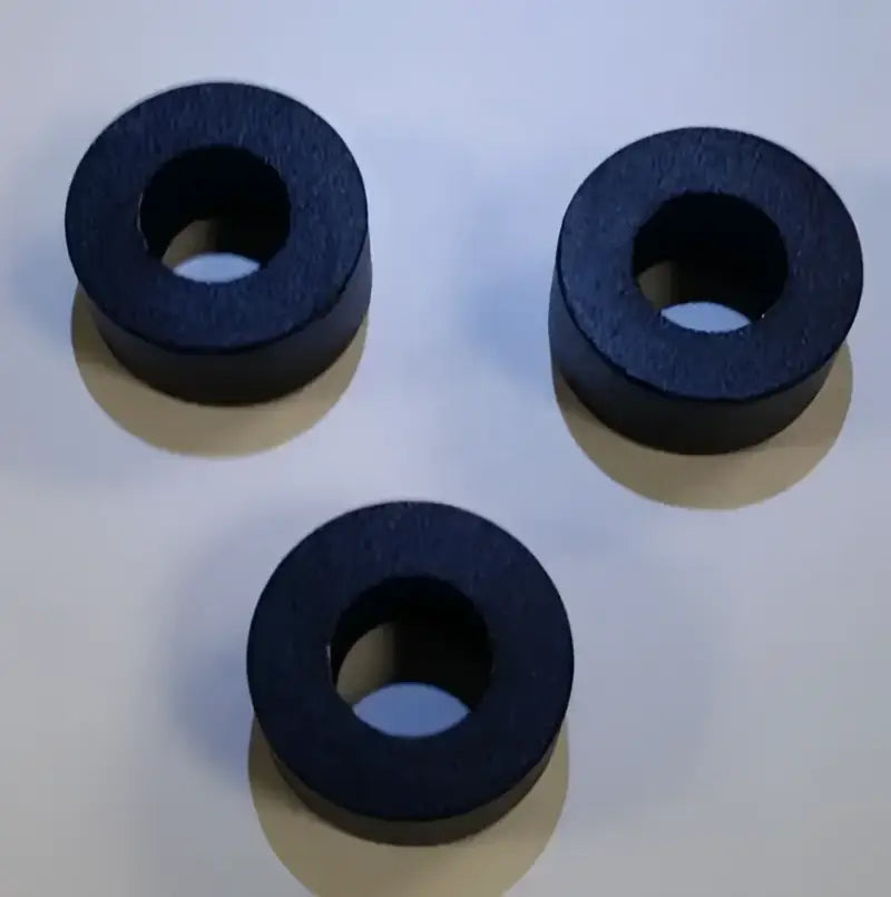 Three black toroidal magnets from the Go Industries GMTHKIT Tow Hook Bolt Kit for towing