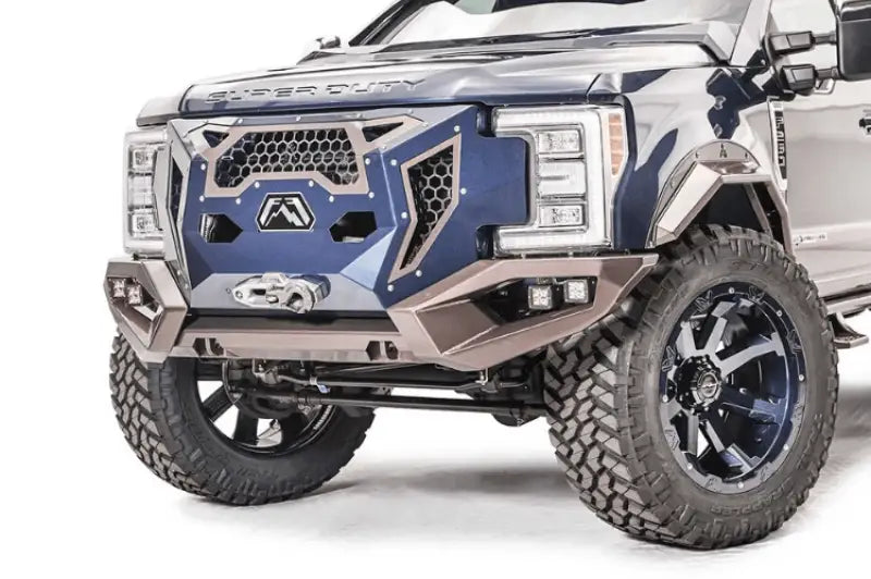 Close-up view of a 2017+ Ford Super Duty featuring the GR4100-1 Fab Fours Grumper, a precision-engineered front bumper and grille combination designed for enhanced aesthetics and reliable front-end protection.