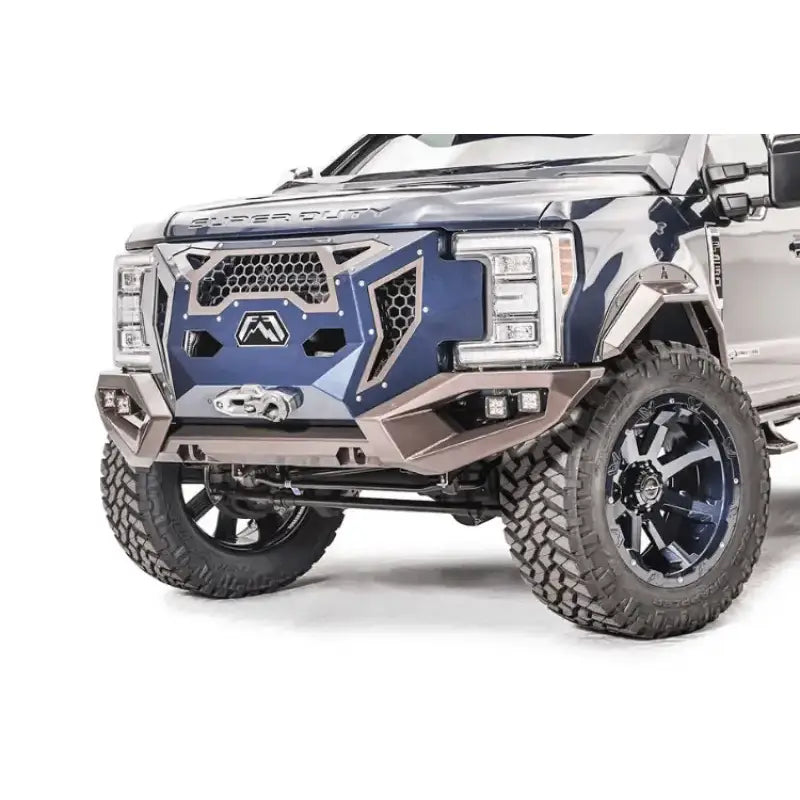 GR4100-1 Fab Fours 17+ Ford Sd Grumper installed on a 2017+ Ford Super Duty, showcasing a unique front bumper and grille combination designed for enhanced aesthetics and robust front-end protection.