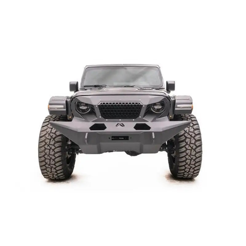 Front view of vehicle equipped with GR4610-1 Fab Fours 18 Jp Jl Grumper Full Width, showcasing enhanced protection and aggressive style.