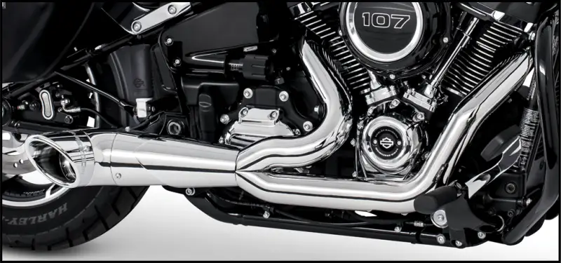 Chrome exhaust system on black Harley-Davidson engine, perfect for turnout exhaust upgrades