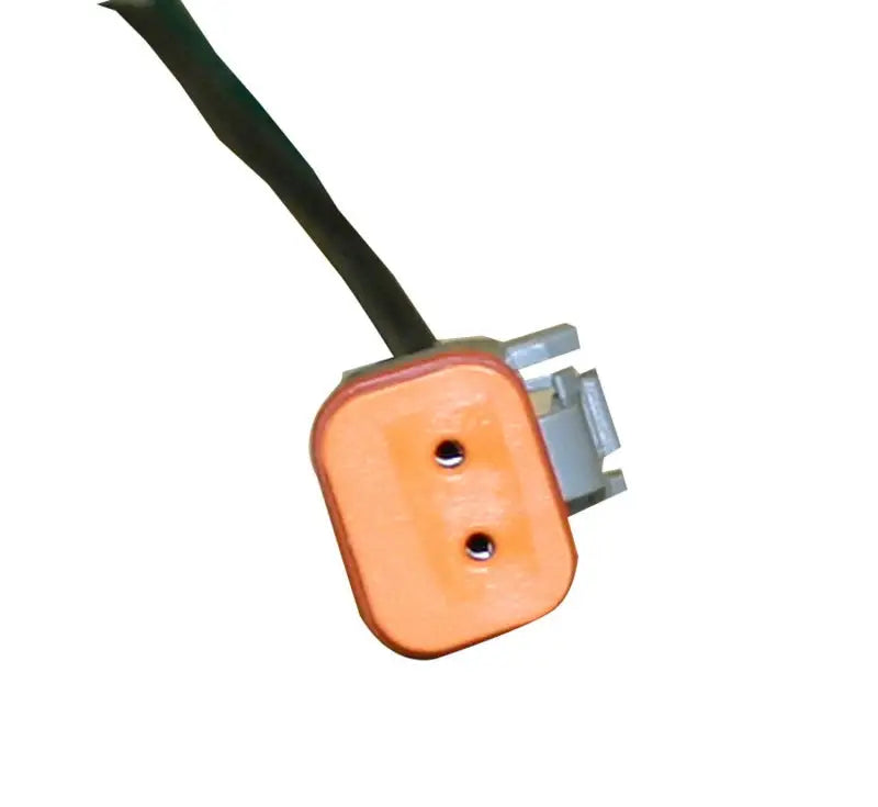 Orange electrical connector with two holes.