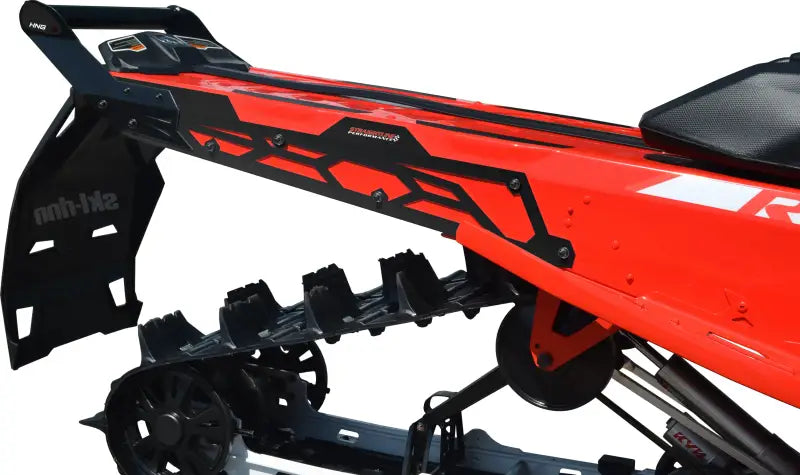 Rear bumper with hidden storage compartment on Red Snowmobile showing black track