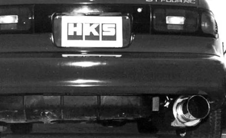 Rear view of a black Toyota Celica with HKS silent hi-power dual exhaust upgrade