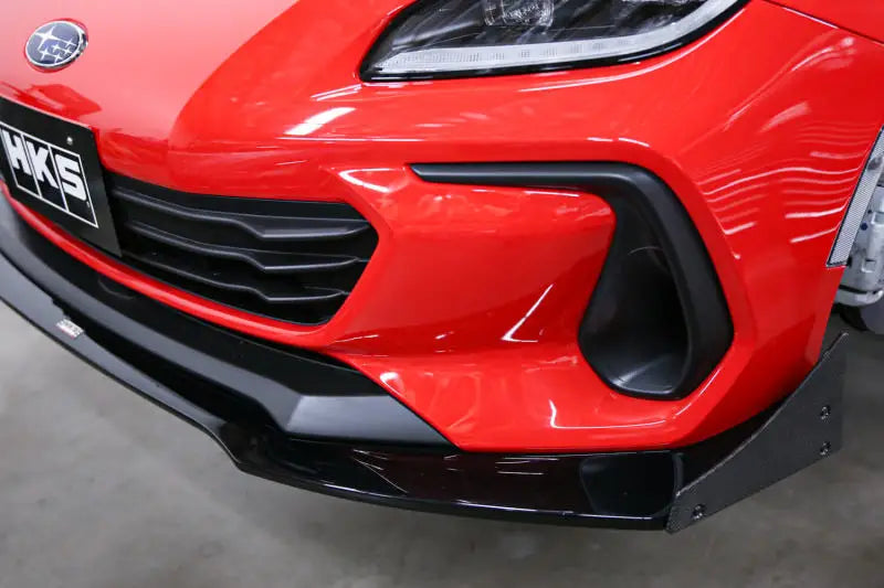 Red Subaru Crosstrek front bumper with black accents and HKS logo for BRZ ZD8 HKS body kit