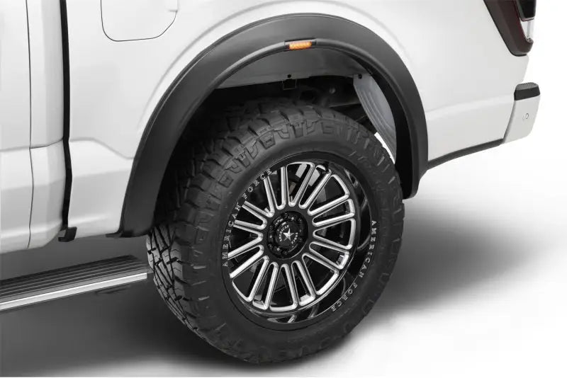 Truck’s rear tire and fender flare.