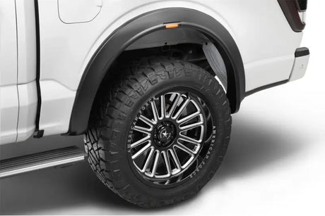 Truck’s rear tire and fender flare.