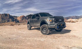 Gray lifted Ford pickup truck.