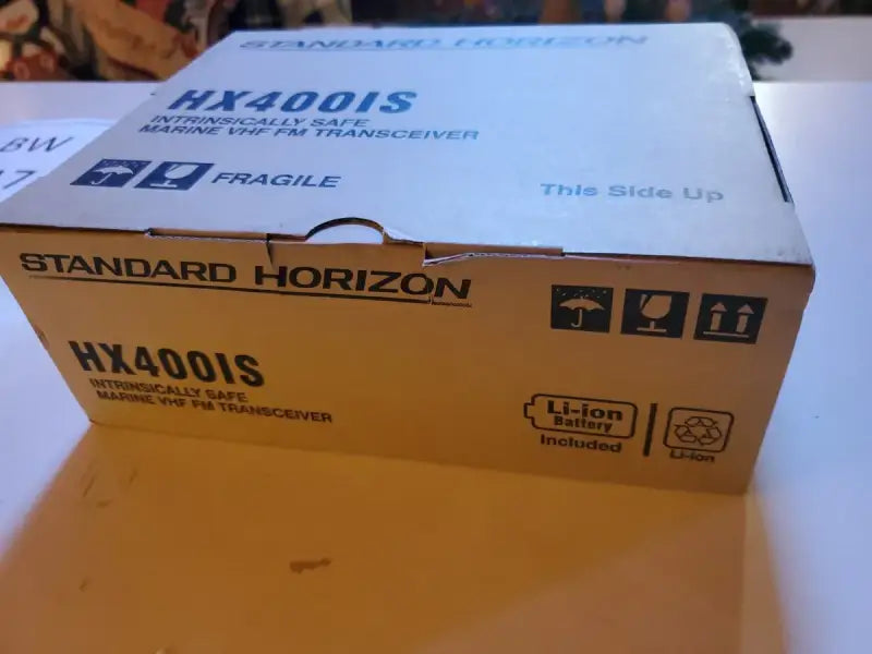 Package of HX400IS Standard VHF Handheld 5Watt Land Mobile Intrinsically Safe Radio by Standard Horizon.