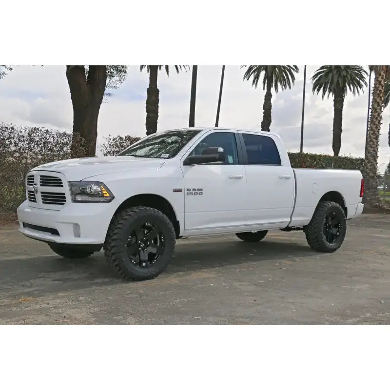 2009-2018 Ram 1500 4WD equipped with ICON Vehicle Dynamics Stage 2 Suspension System featuring 2.5” coilover shocks and Eibach coil springs for improved performance and ride quality.
