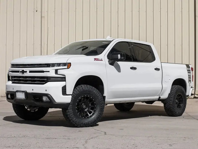 ICON 2019+ GM 1500 1.5-3.5in Stage 2 Suspension System with Tubular UCA installed on a white Chevy Silverado.